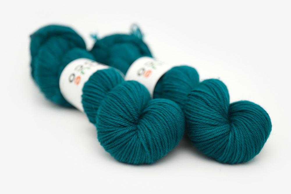 semisolid hand dyed blue green teal worsted yarn