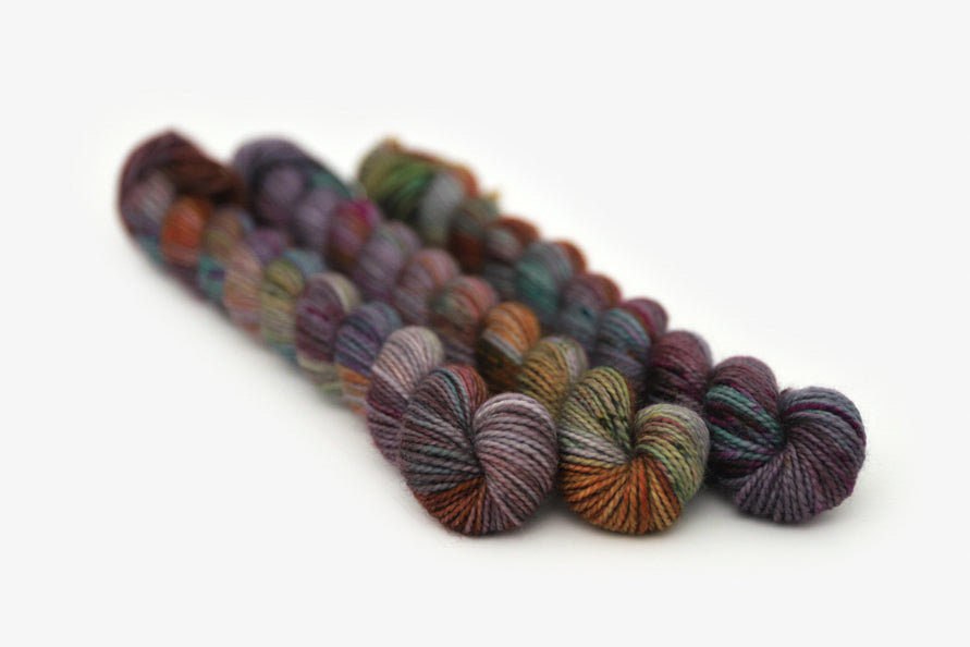 speckled hand dyed dark maroon gray teal orange merino sock mini yarn