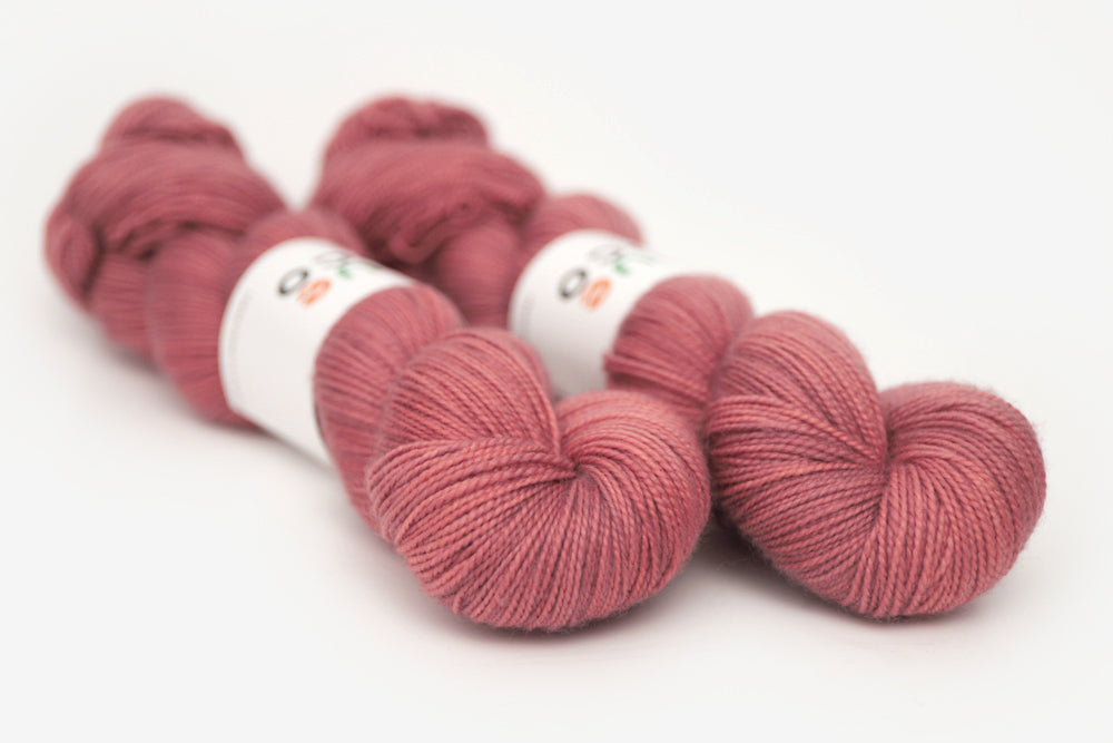 semisolid hand dyed blush (dusty rose pink) merino sock yarn
