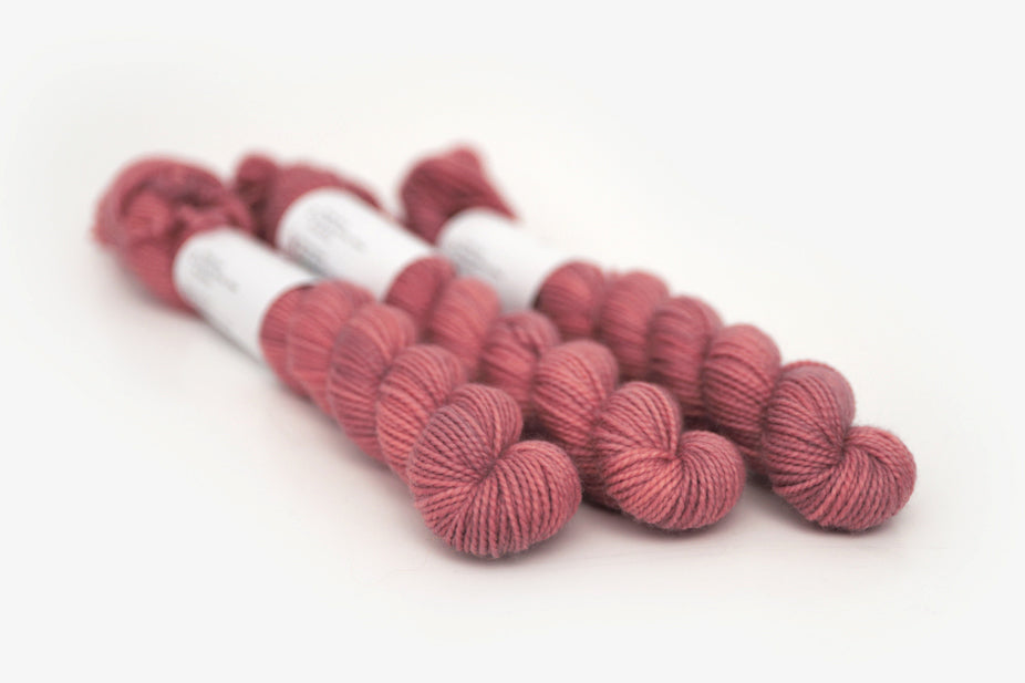 semisolid hand dyed blush (dusty rose pink) merino sock mini yarn