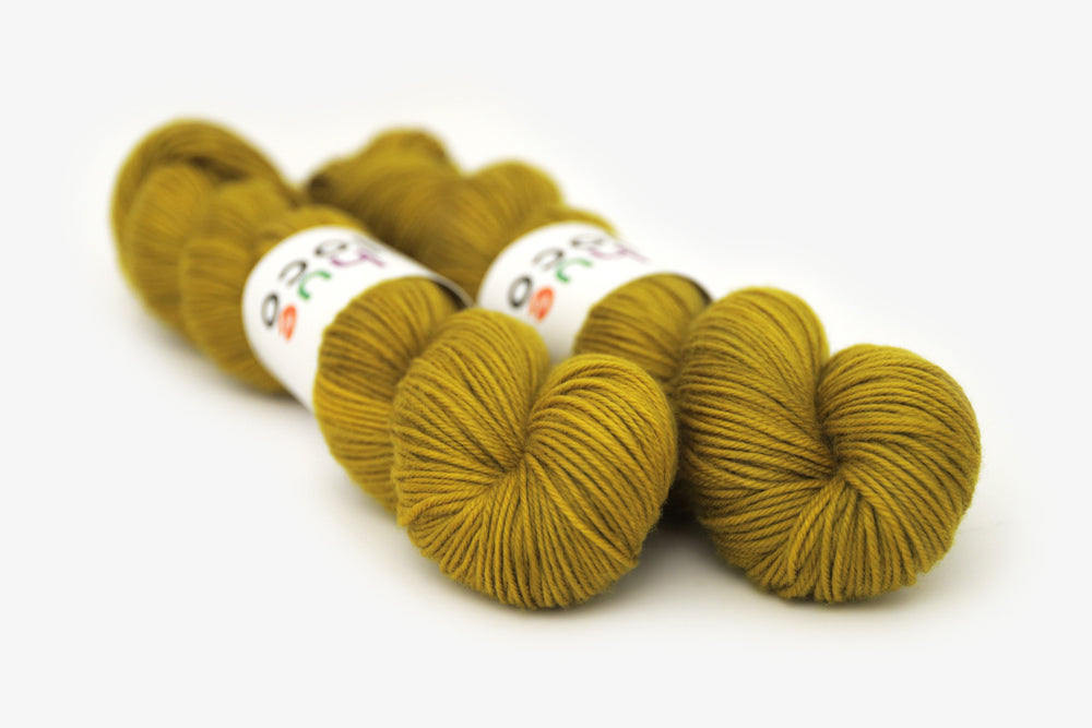 semisolid hand dyed caper (olive yellow green) dk yarn