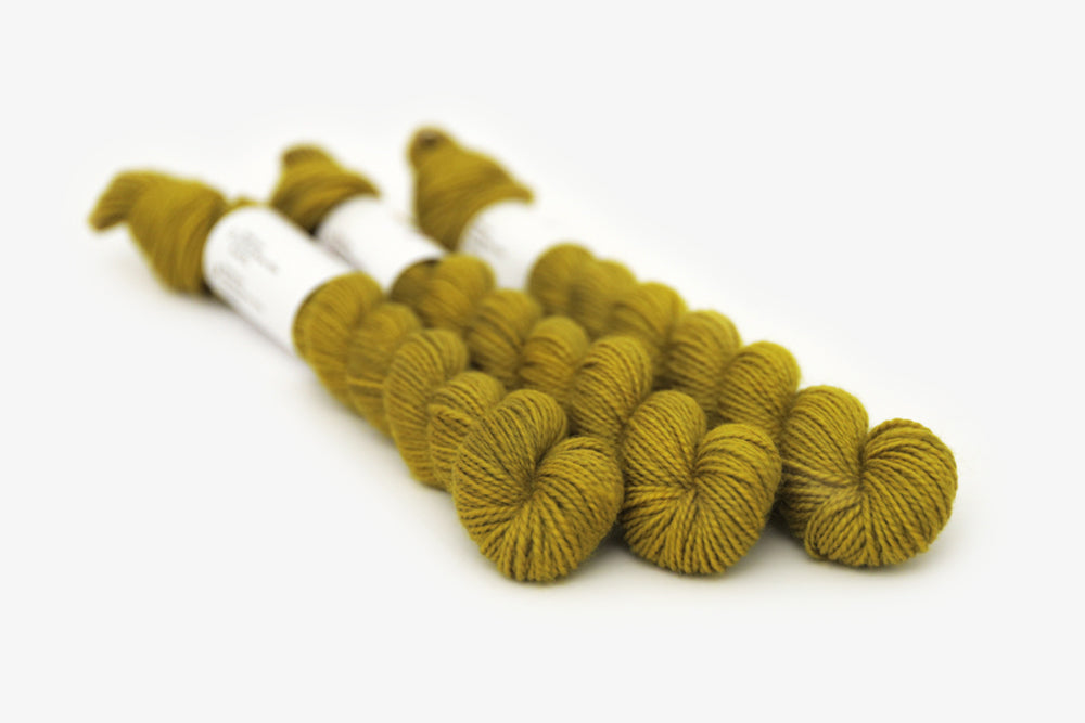 semisolid hand dyed caper (olive yellow green) merino sock mini yarn