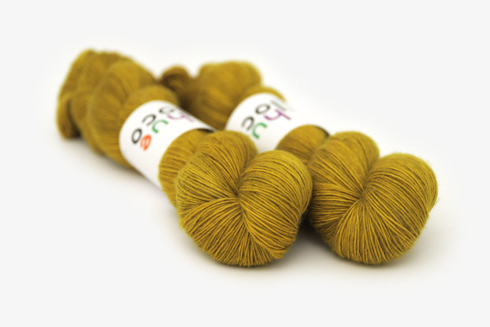 semisolid hand dyed caper (olive yellow green) single sock yarn