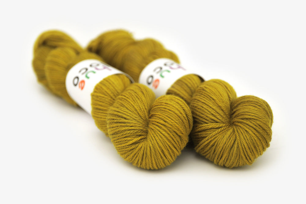semisolid hand dyed caper (olive yellow green) worsted yarn