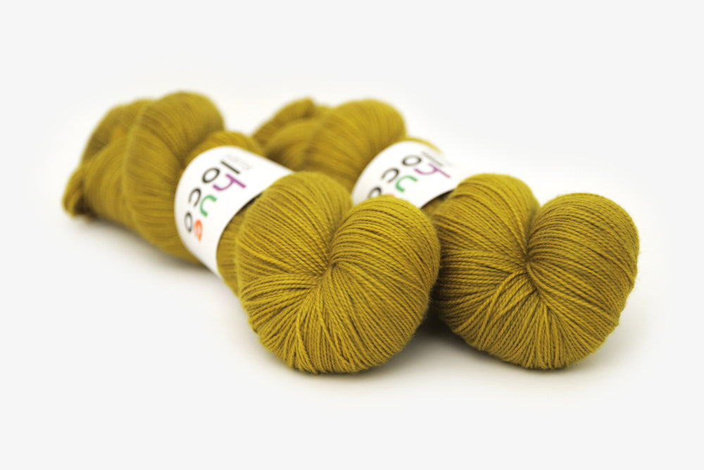 semisolid hand dyed caper (olive yellow green) spun xl yarn