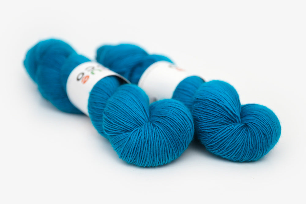 semisolid hand dyed cerulean (bright aqua blue) single sock yarn