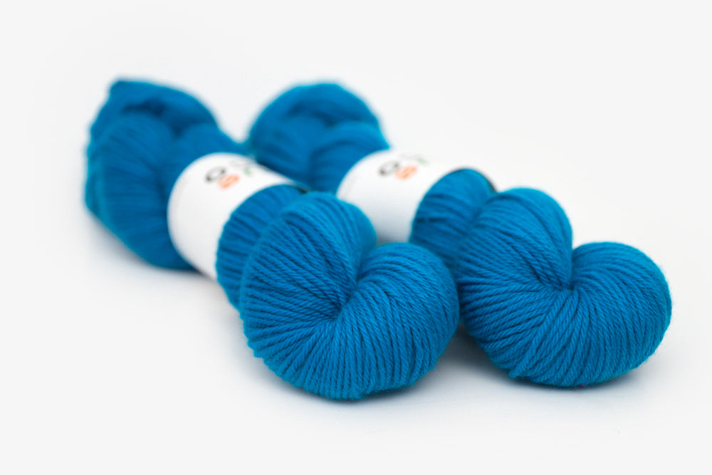 semisolid hand dyed cerulean (bright aqua blue) worsted yarn