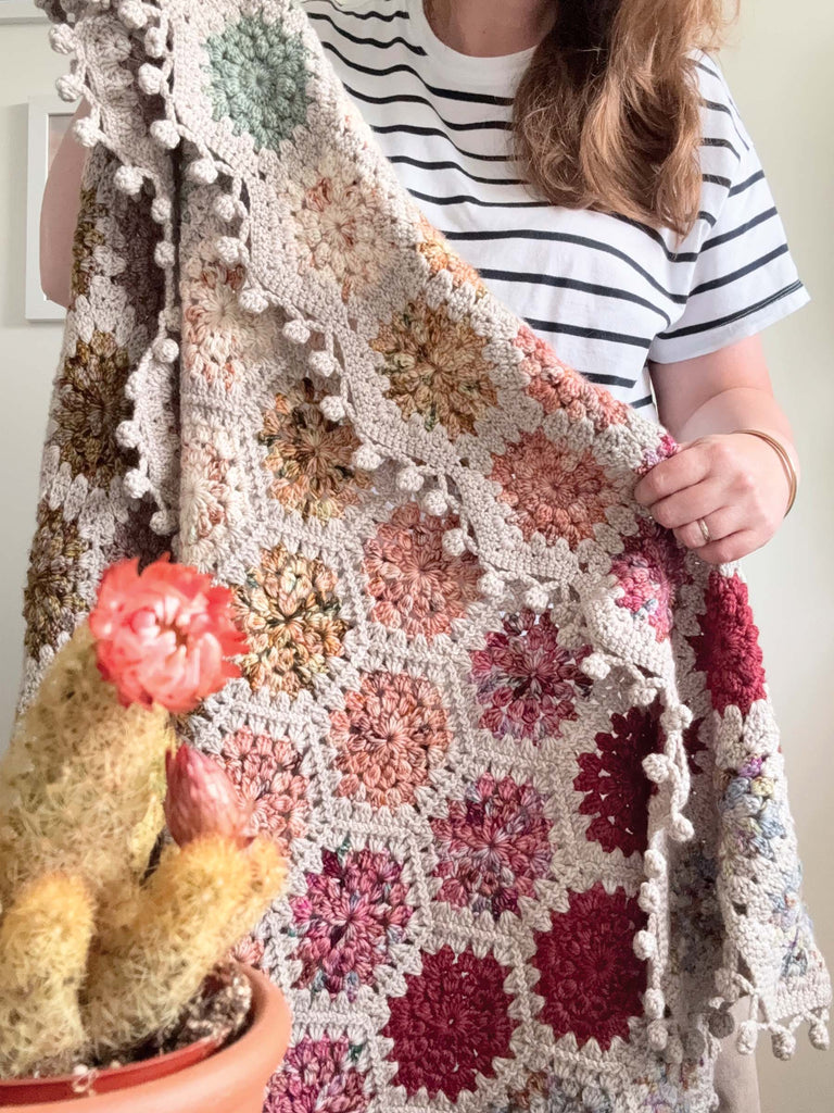 blanket made out of semisolid speckled hand dyed desert colors of dk yarn