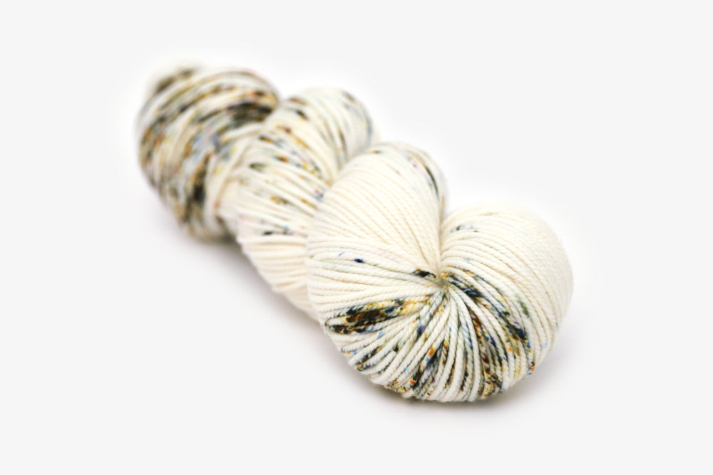 speckled hand dyed white olive yellow blue bulky yarn