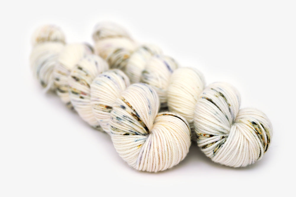 speckled hand dyed white olive yellow blue dk yarn