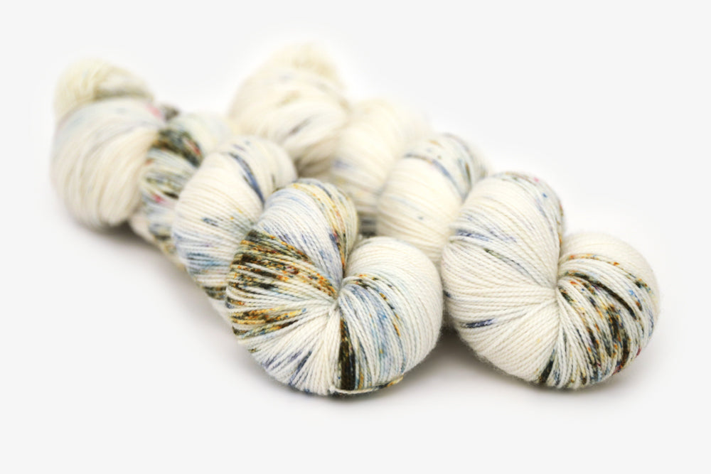 speckled hand dyed white olive yellow blue spun xl yarn