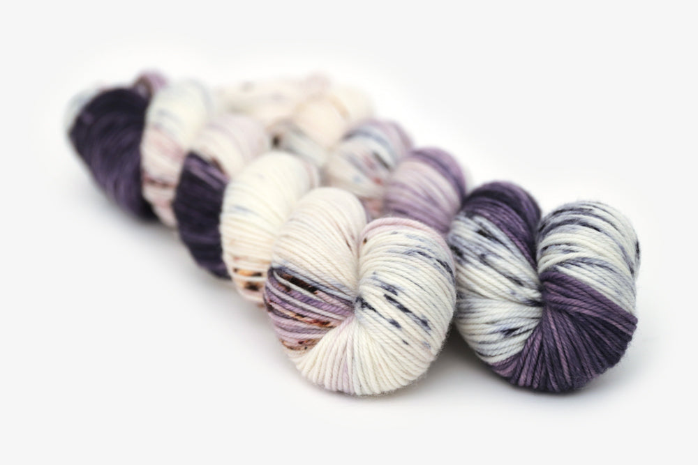 speckled hand dyed dark purple lilac white dk yarn