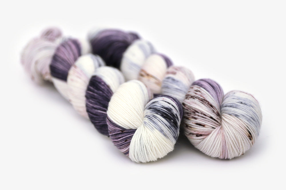 speckled hand dyed dark purple lilac white phyllis sock yarn