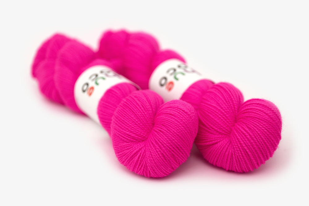 semisolid hand dyed fuchsia (bright hot pink) merino sock yarn