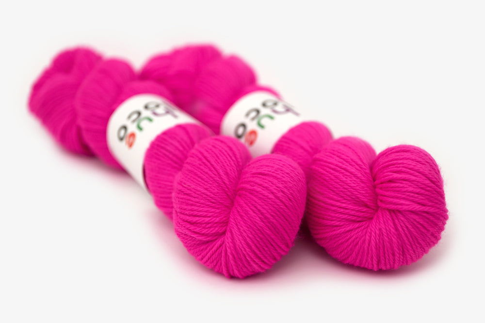 semisolid hand dyed fuchsia (bright hot pink) worsted yarn