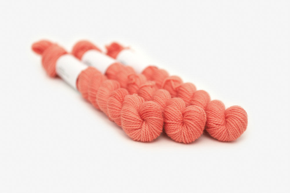semisolid hand dyed coral pink orange merino sock mini yarn