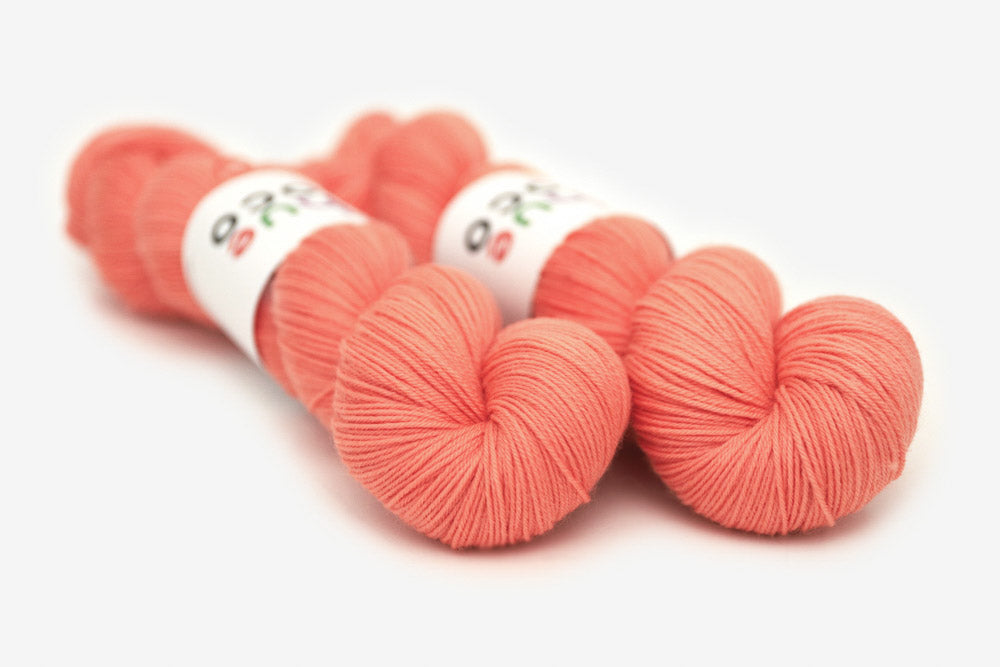 semisolid hand dyed coral pink orange phyllis sock yarn