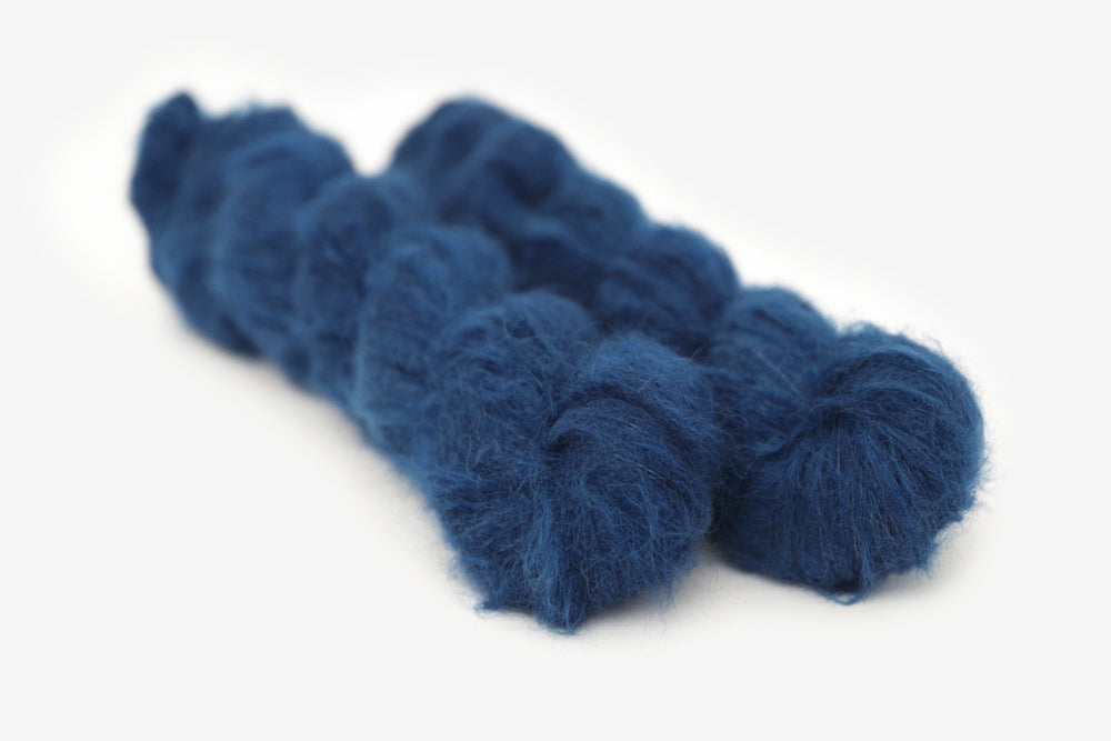 semisolid hand dyed lapis (dark indigo blue) alpaca suri lace yarn