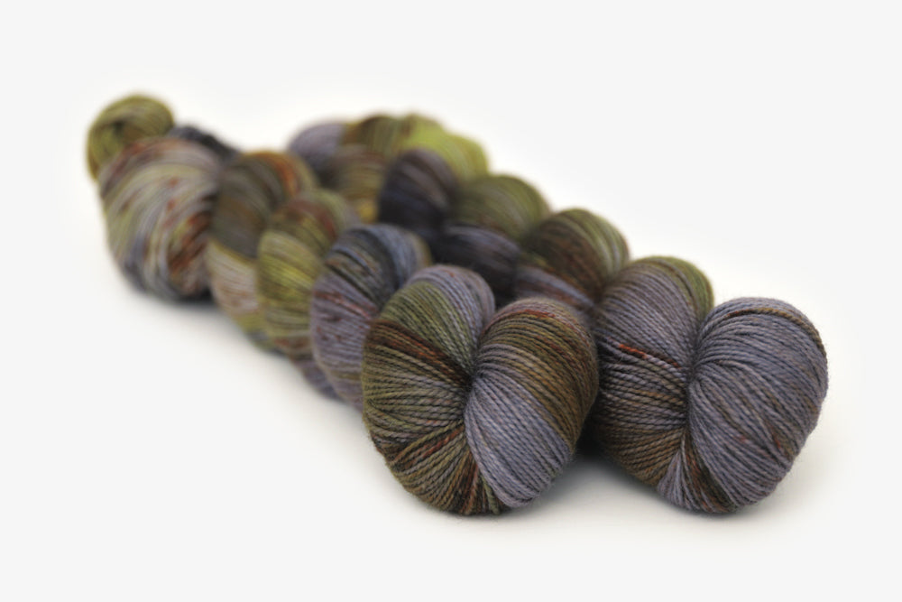 speckled hand dyed green olive dark gray brown merino sock yarn