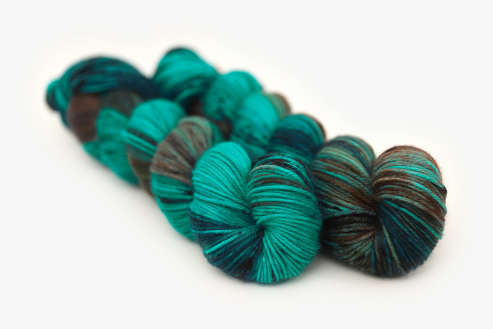 speckled hand dyed teal aqua dark purple dk yarn