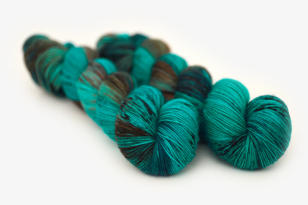speckled hand dyed teal aqua dark purple phyllis sock yarn