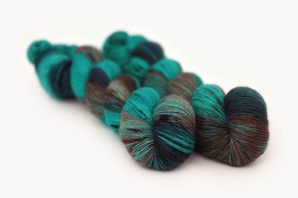 speckled hand dyed teal aqua dark purple single sock yarn