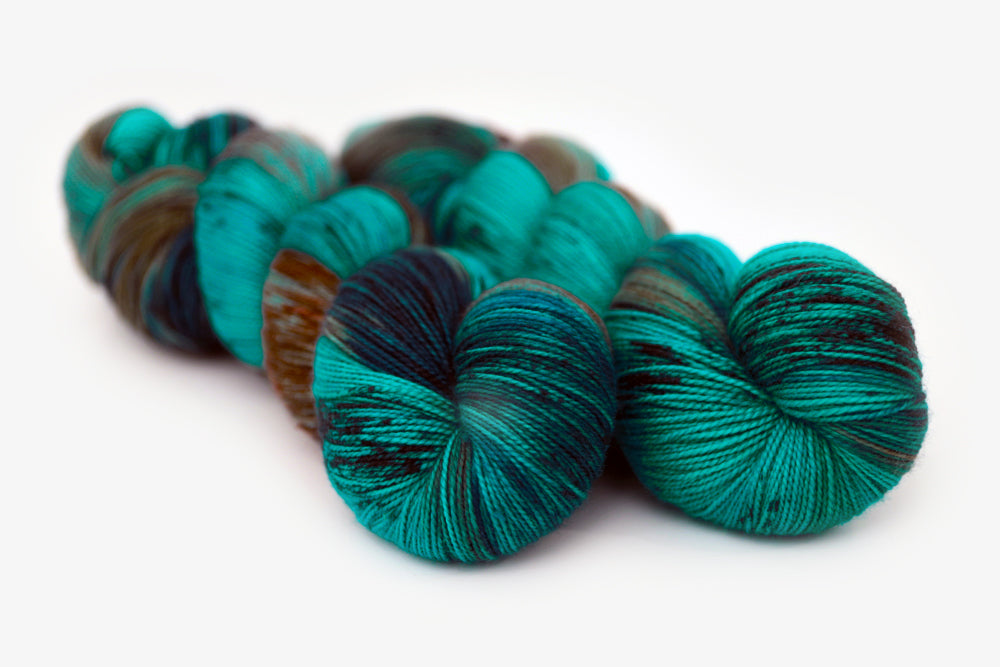 speckled hand dyed teal aqua dark purple spun xl yarn