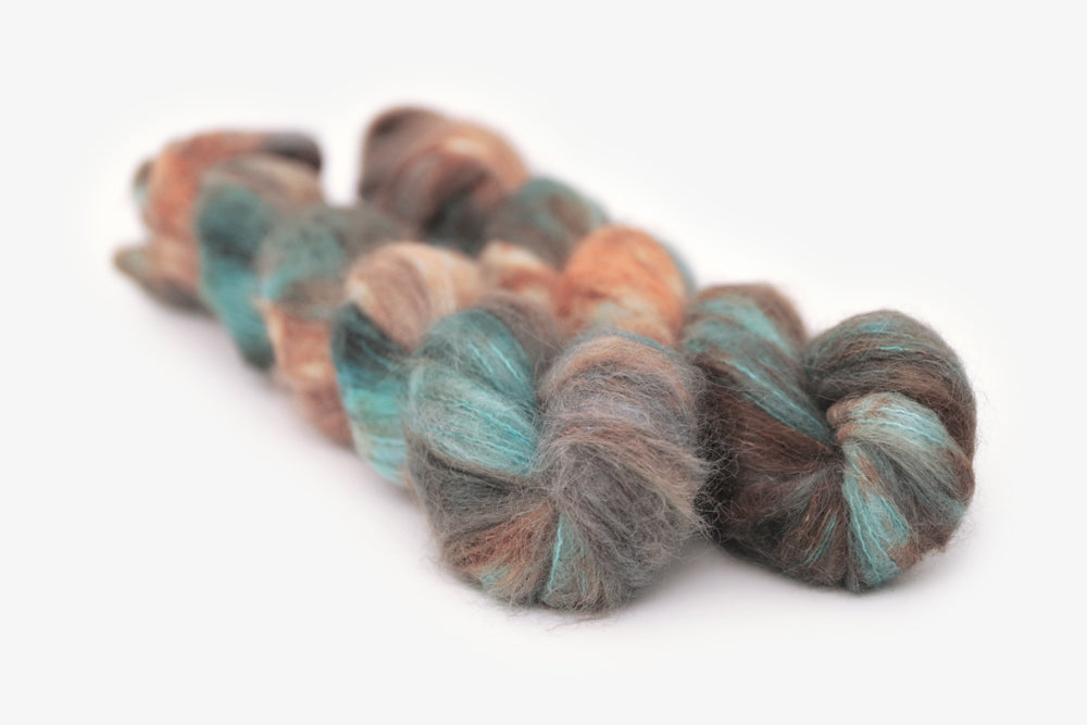 speckled hand dyed blue rust orange sage alpaca suri lace yarn