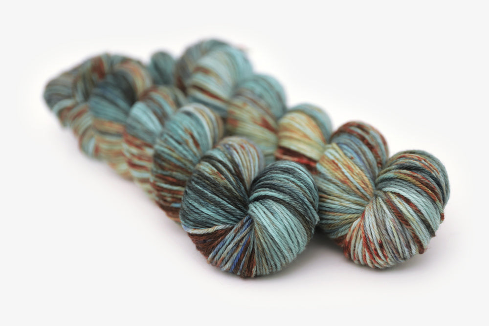 speckled hand dyed blue rust orange sage worsted yarn