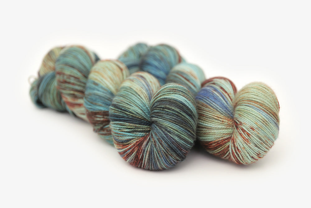 speckled hand dyed blue rust orange sage spun xl yarn