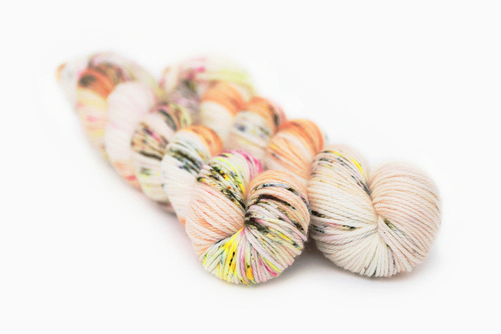 speckled hand dyed pink white neon yellow orange worsted yarn