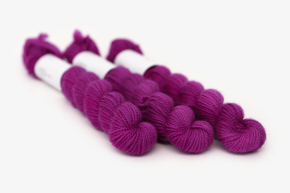 semisolid hand dyed mulberry (magenta berry pink) merino sock mini yarn
