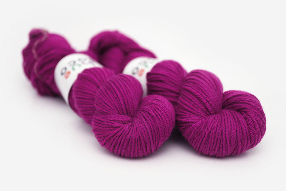 semisolid hand dyed mulberry (magenta berry pink) worsted yarn