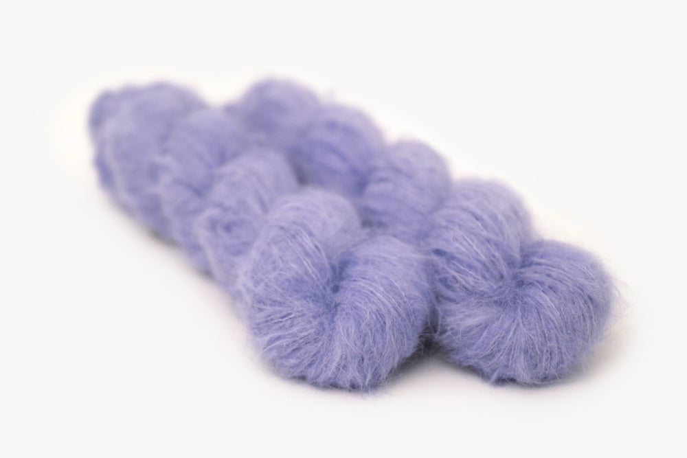 semisolid hand dyed periwinkle (light pastel purple blue) alpaca suri lace yarn