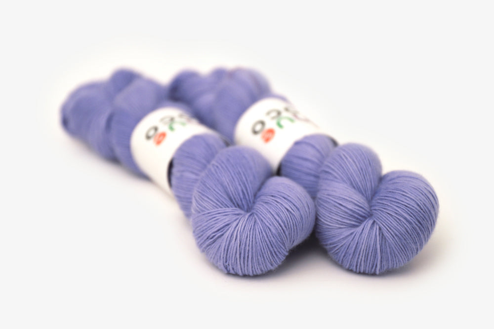 semisolid hand dyed periwinkle (light pastel purple blue) single sock yarn