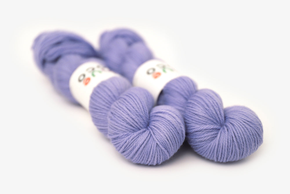 semisolid hand dyed periwinkle (light pastel purple blue) worsted yarn