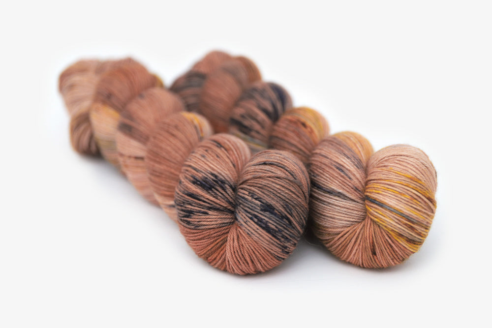 speckled hand dyed dusty pink yellow blue tan phyllis sock yarn