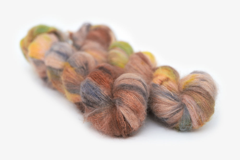 speckled hand dyed dusty pink yellow blue tan alpaca suri lace yarn
