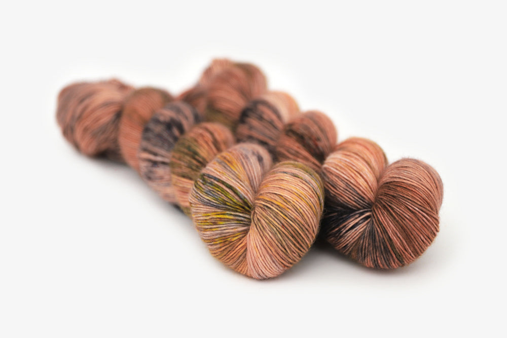 speckled hand dyed dusty pink yellow blue tan single sock yarn