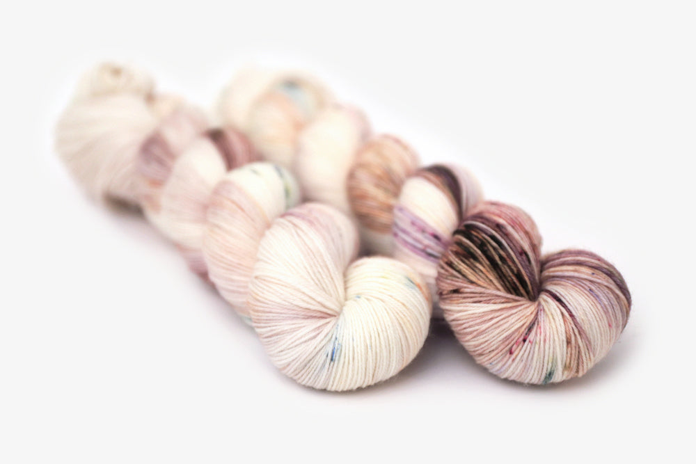 speckled hand dyed white pink mauve maroon phyllis sock yarn
