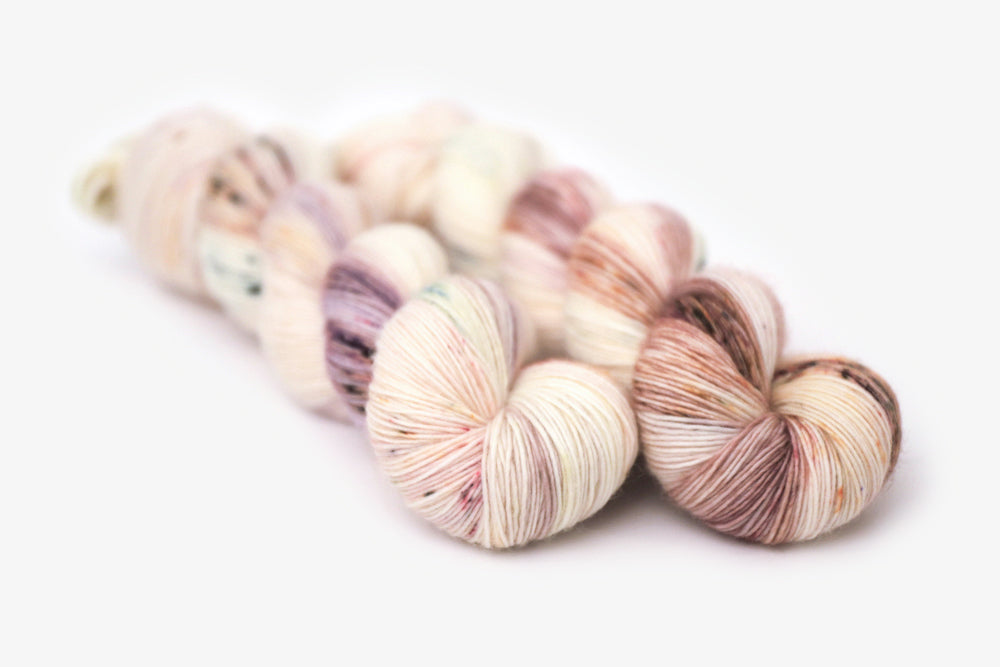 speckled hand dyed white pink mauve maroon single sock yarn