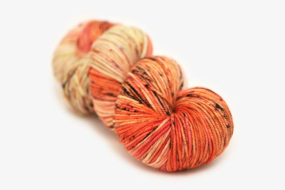 speckled hand dyed bright orange coral pink bulky yarn