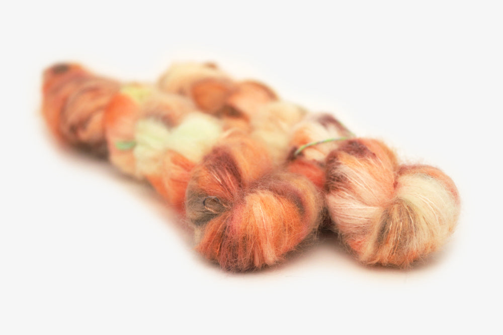 speckled hand dyed bright orange coral pink alpaca suri lace yarn 