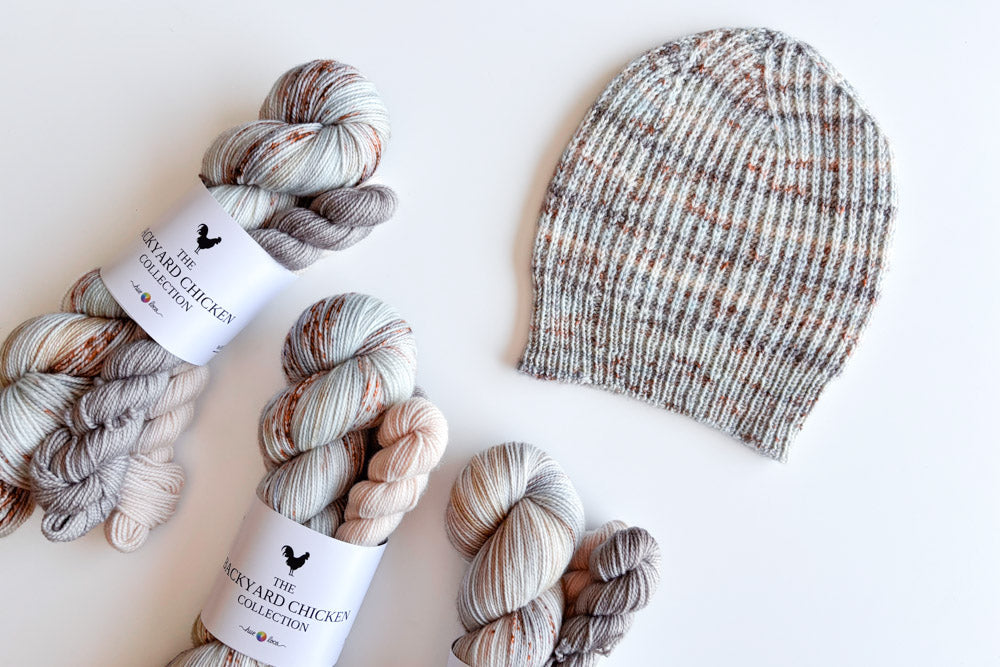 white crested blue polish chicken color palette knit up into a hat