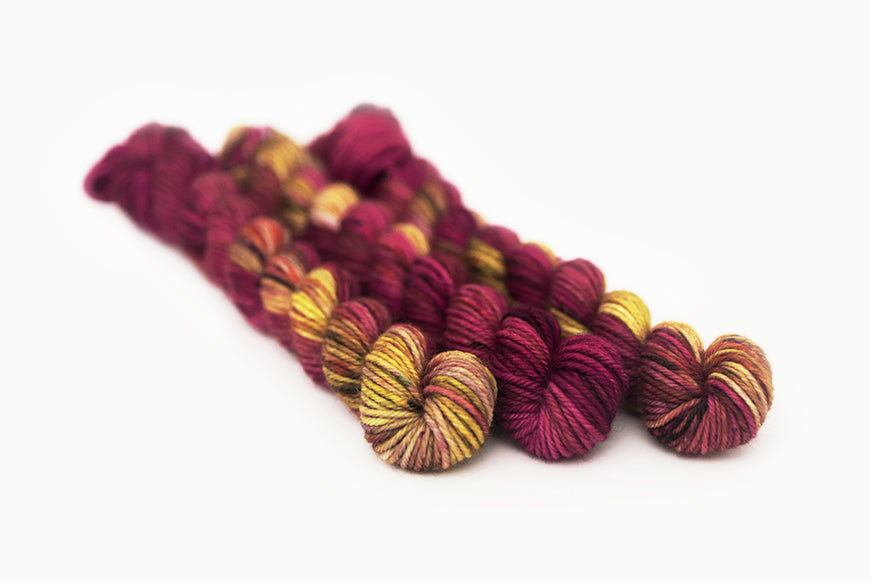 speckled hand dyed magenta gold olive dk mini yarn