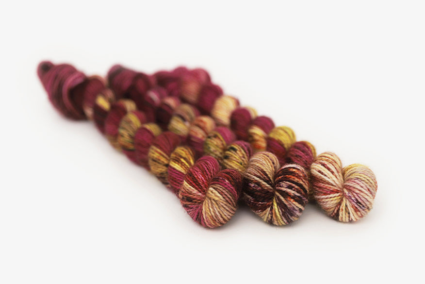 speckled hand dyed magenta gold olive merino sock mini yarn