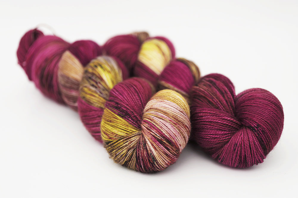 speckled hand dyed magenta gold olive spun xl yarn