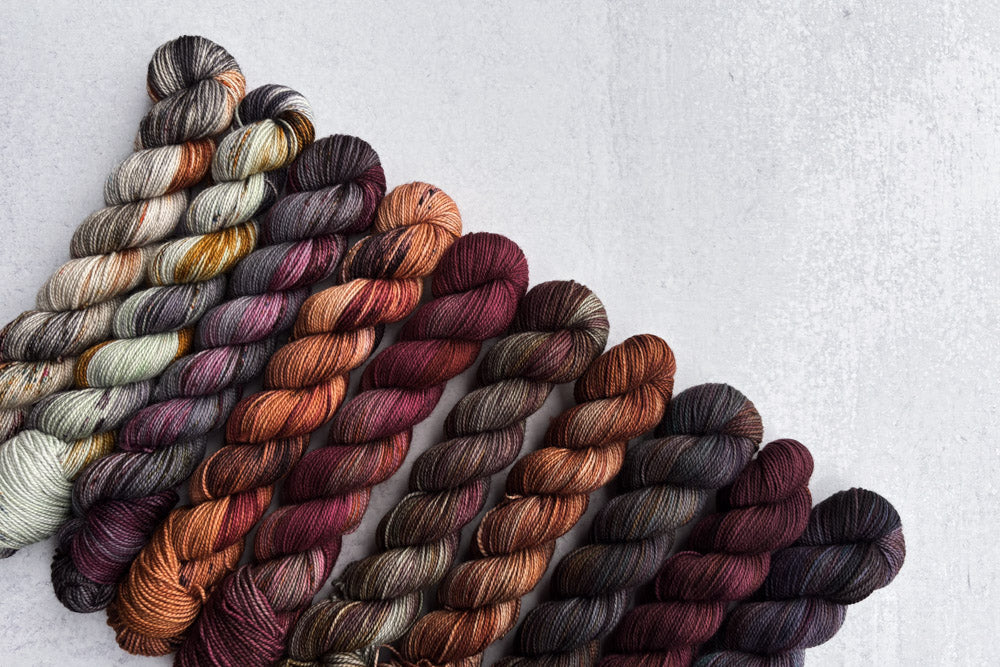 tonal speckled hand dyed orange red gray brown green yarn 50s set