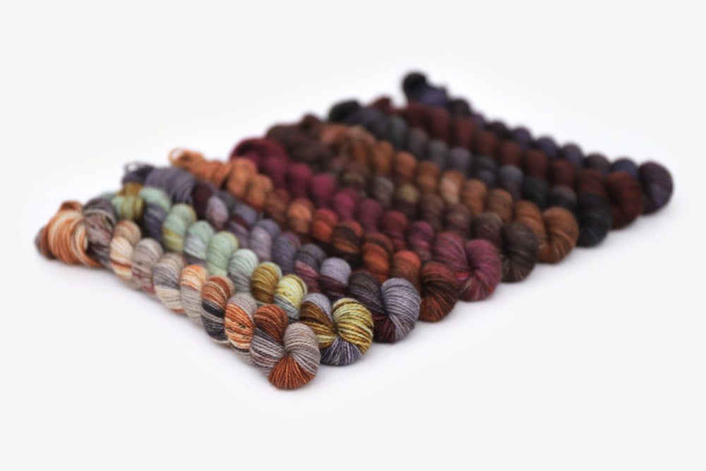 speckled hand dyed orange red gray green yarn mini set