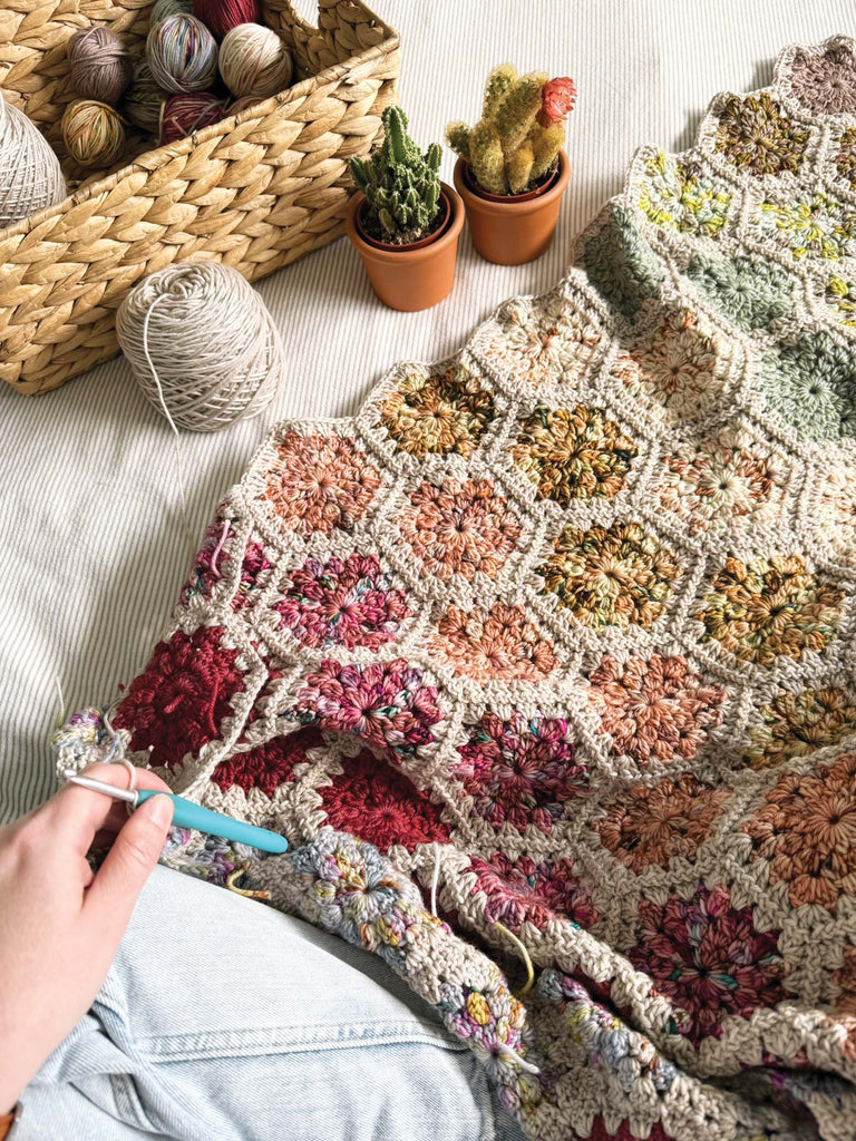 blanket set being crocheted with semisolid speckled hand dyed desert colors of dk yarn